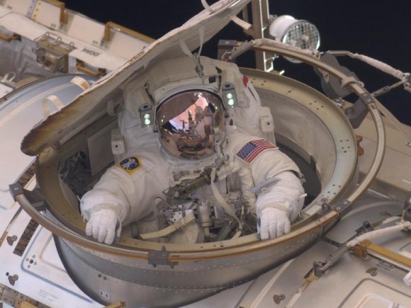 Astronaut Drew Feustel reenters the space station after completing an 8-hour, 7-minute spacewalk at on Sunday, May 22, 2011. He and fellow spacewalker Mike Fincke conducted the second of the four EVAs during the STS-134 mission. Credit: NASA