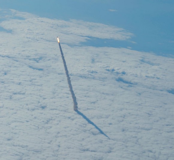 This striking image of Endeavour shooting up through the cloud deck was taken from a shuttle training aircraft on May 16, just seconds after Endeavour launched. Credit: NASA