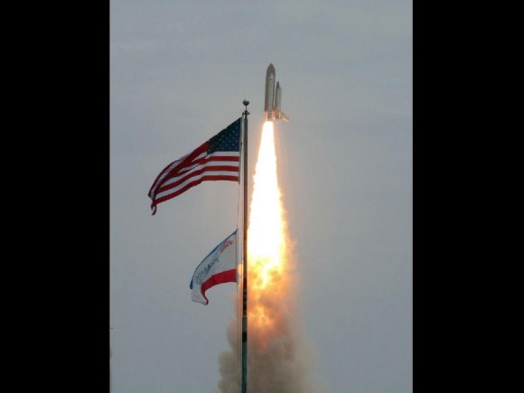 Space shuttle Atlantis launches into history from Launch Pad 39A at NASA's Kennedy Space Center in Florida. credit: NASA/Fletcher Hildreth