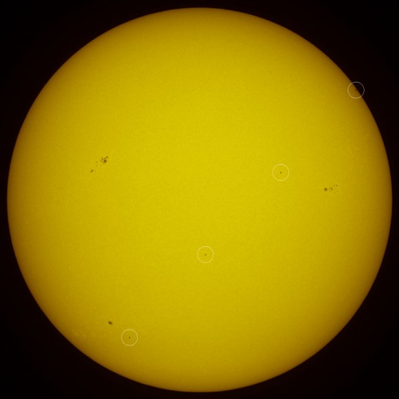 Atlantis appears on four images as it crossed the Sun, in this composite image. Credit: Thierry Legault. Click for larger version.