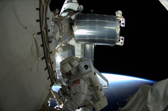 Ron Garan during the spacewalk: "I almost had 1 foot in day and 1 foot in night Orbital sunset," said Garan via Twitter of this picture. Credit: NASA spacewalk #STS135 I almost had 1 foot in day and 1 foot in night Orbital sunset