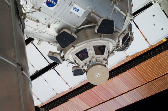 A view of the Cupola on the ISS, and if you look closely, you can see faces of several of the Atlantis STS-135 and Expediton 28 crewmembers looking out the windows. Credit: NASA