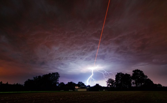 Lightning strikes during a test of a new laser guide star at the Allgäu Public Observatory in Ottobeuren, Germany. Credit: Martin Kornmesser, ESO