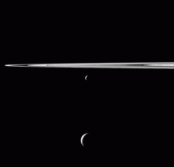 Enceladus and Tethys hang below Saturn's rings in this new image from the Cassini spacecraft. Credit: NASA/JPL-Caltech/SSI