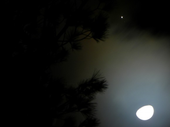The Galilean Satellites of Jupiter are clearly visible just above a halo around the Moon, seen over central Italy on January 21, 2013. Credit: Giuseppe Petricca