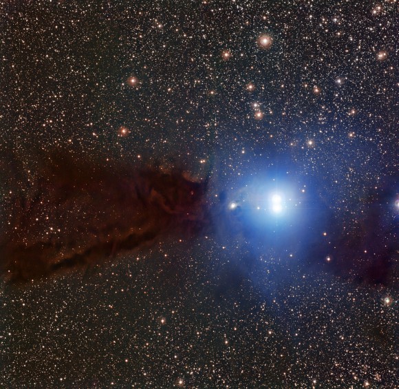 A new image from ESO shows a dark cloud where new stars are forming along with a cluster of brilliant stars that have already emerged from their dusty stellar nursery. Credit: ESO/F. Comeron.