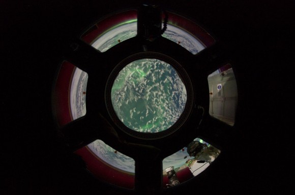 A green tint from an aurora is seen out the Cupola over the southern Indian Ocean. Credit: NASA