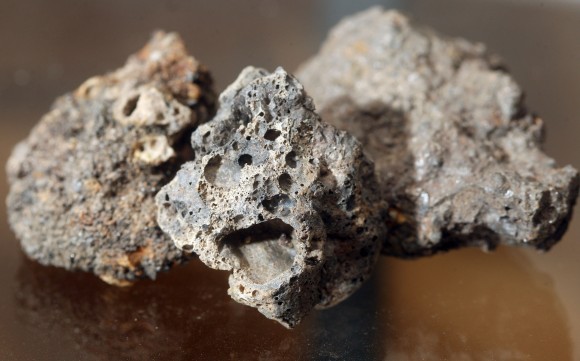 Beware of imitations! These are chunks of industrial slag that are often confused with real meteorites. Meteorites don't have bubbly surfaces. Credit: Bob King