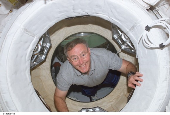 Jerry Ross during the STS-110 mission in 2002, coming through one of the many hatches on the International Space Station. Credit: NASA.