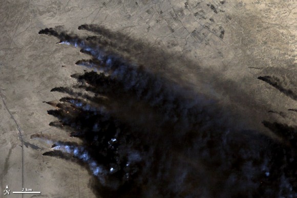 Oil well fires burn in Kuwait during the 1991 Persian Gulf War. Credit: Landsat