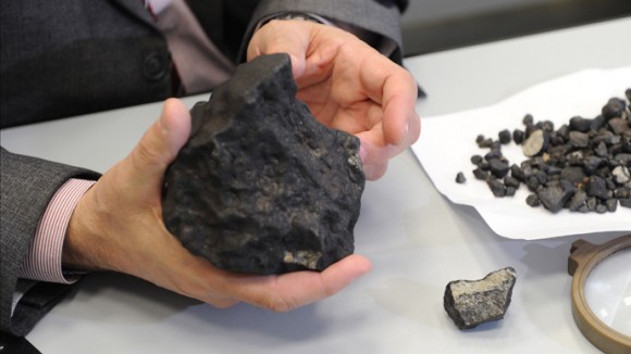 Lecturer at Ural Federal University's Institute of Physics and Technology Viktor Grokhovsky with meteorite fragment found during an expedition in the Chelyabinsk region on February 25, 2013. Credit: RIA Novosti / Pavel Lysizin.