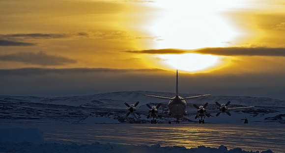 NASA P-3B waits outside the hangar at Thule Air Base with the Greenland Ice sheet in the background. The aircraft is set to begin the 2013 season of NASA’s Operation IceBridge mission to survey Earth's polar ice sheets in unprecedented three-dimensional detail. The plane just arrived from NASA Wallops Flight Facility in Virginia - see my P-3B photos below. Credit: NASA/Goddard/Michael Studinger