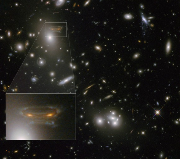 The image of a spiral galaxy has been stretched and mirrored by gravitational lensing into a shape similar to that of a simulated alien from the classic 1970s computer game Space Invaders Credit: NASA, ESA, and the Hubble Heritage/ESA-Hubble Collaboration