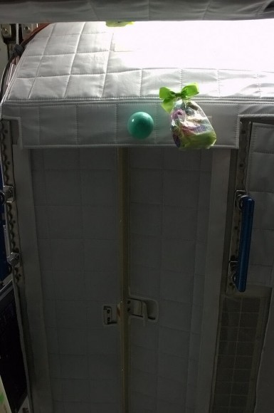 This sleep pod apparently makes for a great hiding spot for Easter eggs and gift baskets on the ISS. Credit: NASA