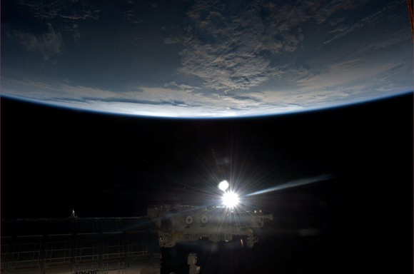 Easter Finale: The Sun, a bright point of light surrounded by profound blackness, our world glowing in-between. Credit: NASA/Chris Hadfield