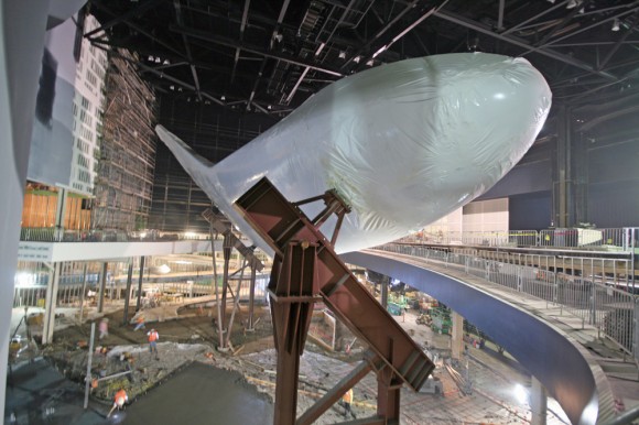 Shrink-wrapped Space Shuttle Atlantis inside museum home under construction at the Kennedy Space Center Visitor complex in Florida - mounted on pedestals. Credit: Ken Kremer (kenkremer.com)