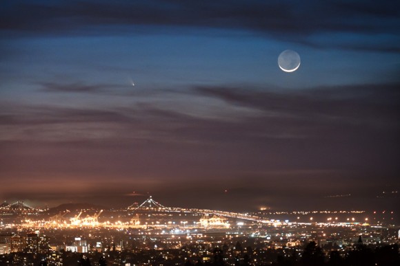 Comet PANSTARRS seen from Oakland, California. The Port of Oakland and the Bay Bridge are in the foreground with the comet and crescent moon in the background. Taken on March 12, 2013. Credit and copyright: Jared Wilson.