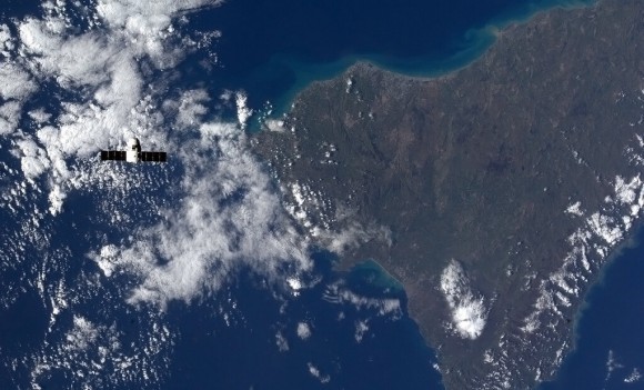 'The Dragon spaceship high over Mount Etna - both spitting fire.' Credit: NASA/Chris Hadfield.