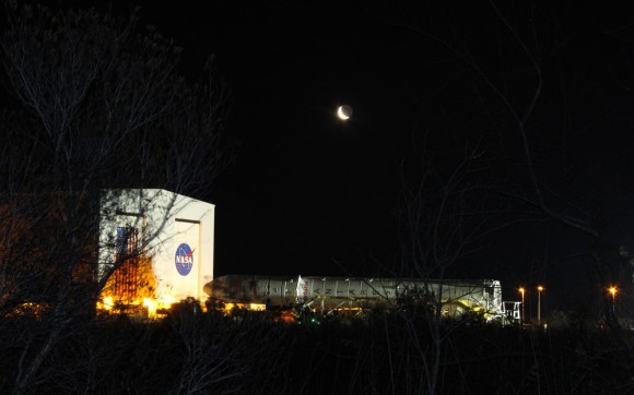 Antares rocket begins 1st ever rollout from processing hanger to NASA Wallops launch pad - beneath the Moon on 6 April 2013. Credit: Ken Kremer (kenkremer.com)