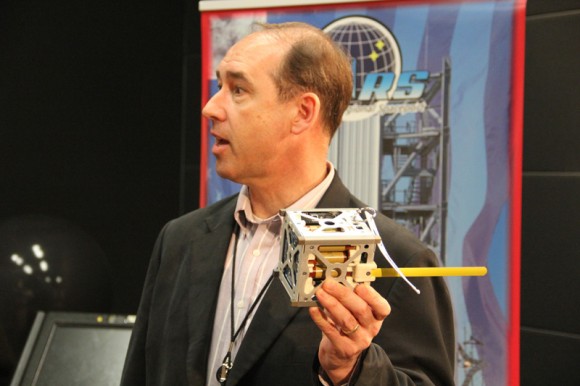 Andrew Petro, NASA Small Satellite Program executive, holds NASA Smartphone Phonesat replica launched on Antares test flight on April 21, 2013. Credit: Ken Kremer (kenkremer.com)