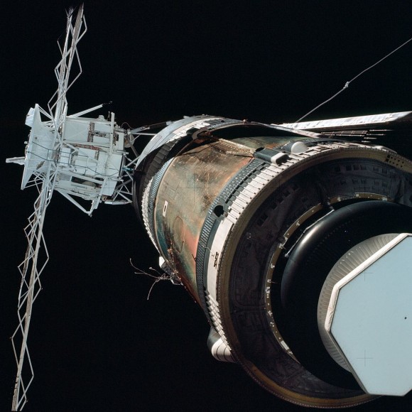 View of crippled Skylab complex during ‘fly around’ by the first crew shows missing micrometeoroid shield and stuck solar panel which luckily was not ripped off during launch. Credit: NASA