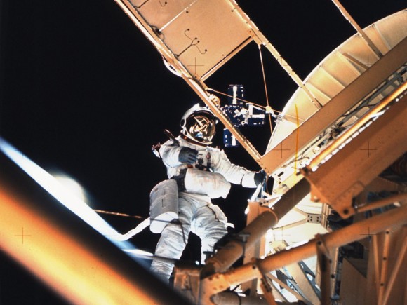 Owen Garriott Performs a Spacewalk During Skylab 3 Astronaut Owen Garriott performs a spacewalk at the Apollo Telescope Mount (ATM) of the Skylab space station cluster in Earth orbit, photographed with a hand-held 70mm Hasselblad camera. Garriott had just deployed the Skylab Particle Collection S149 Experiment. The experiment was mounted on one of the ATM solar panels. The purpose of the S149 experiment was to collect material from interplanetary dust particles on prepared surfaces suitable for studying their impact phenomena. Earlier during the spacewalk, Garriott assisted astronaut Jack Lousma, Skylab 3 pilot, in deploying the twin pole solar shield. Credit: NASA