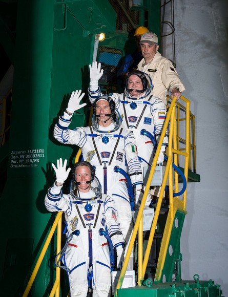 Expedition 36/37 Soyuz Commander Fyodor Yurchikhin of the Russian Federal Space Agency (Roscosmos), top, Flight Engineers: Luca Parmitano of the European Space Agency, center, and Karen Nyberg of NASA, bottom, wave farewell as they board the Soyuz rocket ahead of their launch to the International Space Station, Wednesday, May 29, 2013, Baikonur, Kazakhstan. Credit: NASA/Bill Ingalls.
