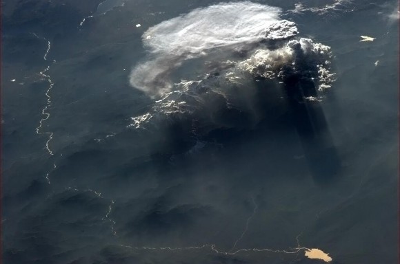 Shadow play of cloud and mountain at sunset, as seen from the International Space Station. Credit: NASA/CSA via Chris Hadfield.