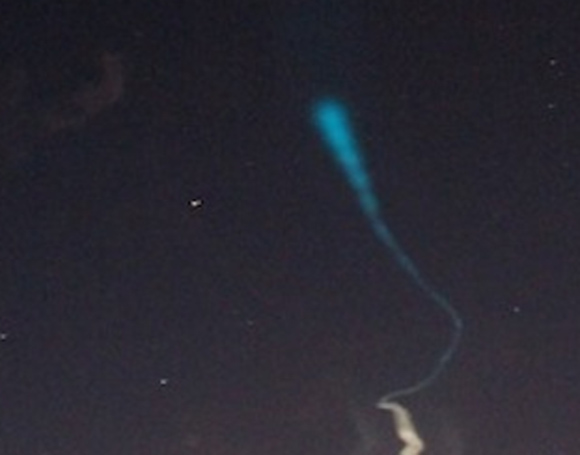 Glowing trails seen in the early morning sky over the Marshall Islands (NASA/Jon Grant)