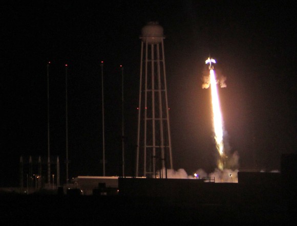 A powerful NASA Black Brant XII suborbital rocket streaks into the night sky following its launch at 11:05 p.m. EDT on June 5, 2013 from the NASA Wallops Flight Facility at the eastern Virginia shoreline. The launch pad sits in front of the Antares rocket Launch Complex 0A dominated by the huge water tower. The rocket carried the Cosmic Infrared Background ExpeRiment (CIBER) to an altitude of approximately 358 miles above the Atlantic Ocean to study when the first stars and galaxies formed in the universe and how brightly they burned their nuclear fuel. Credit: Ken Kremer - kenkremer.com