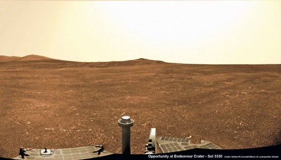 Opportunity captures a panoramic view of the road ahead to the raised rim of Solander Point (at left) which is some 0.8 mile (1.3 km) away. Arrival is targeted for August. It features a thick strata of ancient rocks which may harbor clay minerals indicative of a habitable zone and northerly tilted slopes to maximize power generation from the solar panels during upcoming 6th winter season at Endeavour crater rim. This navcam photo mosaic was taken on Sol 3330, June 6, 2013. Credit: NASA/JPL/Cornell//Marco Di Lorenzo/Ken Kremer (kenkremer.com)