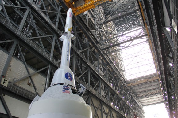 Technicians work on mockups of the Orion crew capsule, Service Module and 6 ton Launch Abort System (LAS) to simulate critical assembly techniques inside the Vehicle Assembly Building (VAB) at NASA’s Kennedy Space Center (KSC) in Florida for the EFT-1 mission due to liftoff in September 2014. Credit: Ken Kremer/kenkremer.com