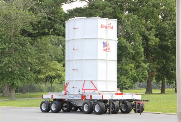 Cygnus spacecraft is loaded onto the Cygnus Vertical Carrier (CVC) 16-wheeled transporter to move between processing facilities at NASA’s Wallops Island launch site. Credit: Ken Kremer (kenkremer.com)