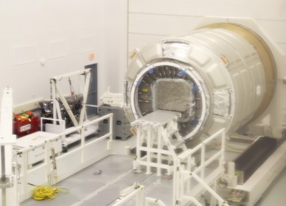 1st operational Cygnus pressurized cargo module from Orbital Science Corp. and newly arrived from Italy sits inside high bay processing facility at NASA Wallops Flight Facility, VA.  This Cygnus may launch to the ISS as early as December 2013. Credit: Ken Kremer (kenkremer.com)