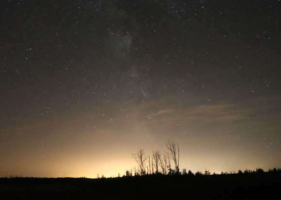 Urban sprawl and accompanying light pollution is an issue for both astronomers and fireflies. This view shows the light dome from the city of Duluth, Minn. 20 miles north of town. Credit: Bob King