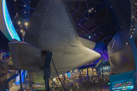 The belly of space shuttle Atlantis in the new exhibit at the Kennedy Space Center. Credit: Steven Coates