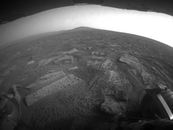 This view from July 2, 2013 (Sol 3355) shows the terrain that NASA's Mars Exploration Rover Opportunity is crossing in a flat area called "Botany Bay" on the way toward "Solander Point," which is visible on the horizon. Credit: NASA/JPL-Caltech