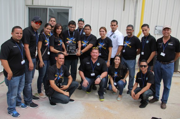 Rocket science university students from Puerto Rico pose for post flight photo op with their disengaged science experiment seeking to capture meteorite particles from space aboard Terrier-Improved Malemute sounding rocket that launched on Aug. 13 at 6 a.m. from NASA Wallops Flight Facility, VA. Credit: Ken Kremer/kenkremer.com