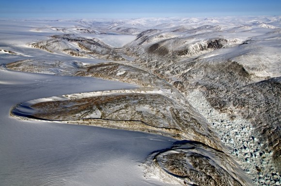 Horseshoe-shaped lateral moraines at the margin of the Penny Ice Cap on Baffin Island, Nunavut, Canada. Lateral moraines are accumulations of debris along the sides of a glacier formed by material falling from the valley wall. Credit: NASA / Michael Studinger