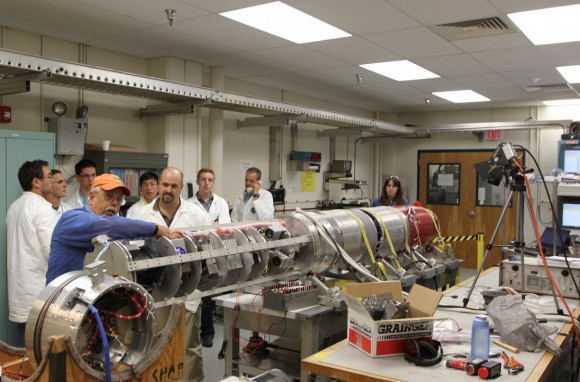 Students from Northwest Nazarene University observe the pre-integration of their experiment into the RockSat-X payload at the NASA Wallops Flight Facility in June. Students from seven universities are participating in the program and will attend the launch on August 13. Credit: NASA/K. Koehler