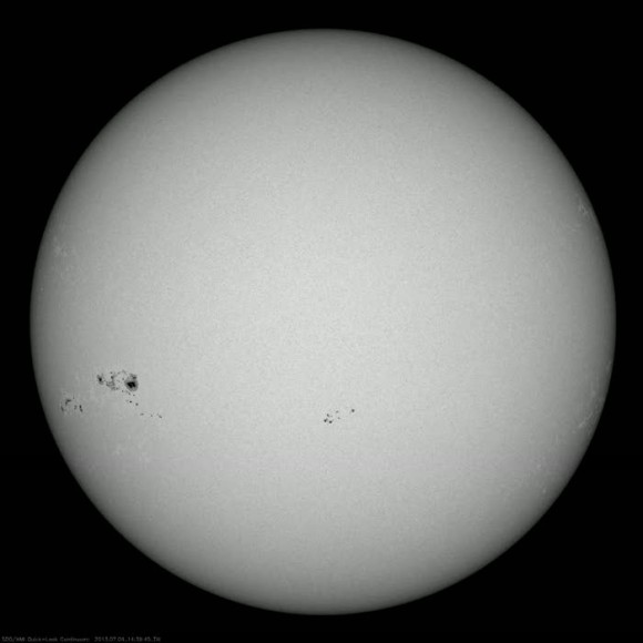 A massive sunspot group that rotated into view in early July, 2013... one of the largest seen for solar cycle #24 thus far. (Credit: NASA/SDO).