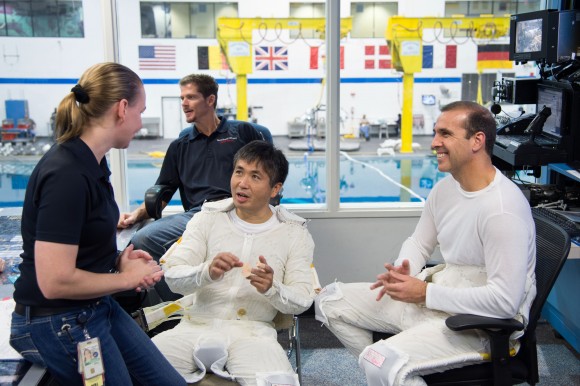 In white suits: JAXA astronaut Koichi Wakata (left) and NASA astronaut Rick Mastracchio during spacewalk training for Expeditions 38/39. Credit: NASA