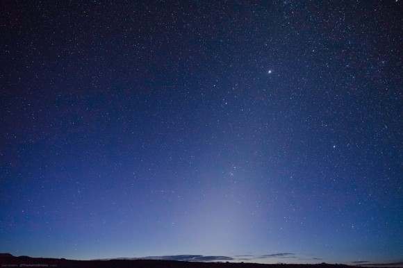 The zodiacal light in the Nevada dawn. The plane of the ecliptic can be traced by Jupiter in Gemini & Mars in the Beehive cluster just below center. (Credit: Cory Schmitz, used with permission).