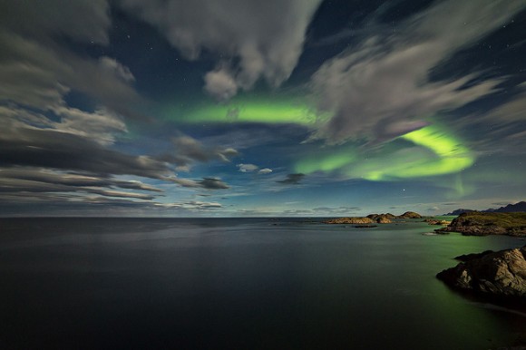 Aurora among the clouds at twilight in Norway on September 18, 2013. Credit and copyright: Frank Olsen.