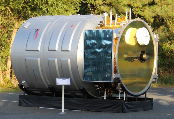 After launching to orbit atop the Antares rocket on Sept. 18, the first ever Cygnus cargo spacecraft is chasing the ISS and set to dock on Sept 22. Until then you may be able to track it in the night skies. Here is full scale, high fidelity mockup of Cygnus to give a feel for its size being similar to a small room. Credit: Ken Kremer (kenkremer.com)