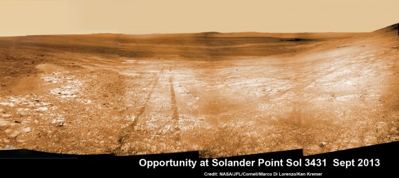 Opportunity starts scaling Solander Point - her1st mountain climbing goal. See the tilted terrain and rover tracks in this mosaic view from Solander Point peering across the vast expanse of huge Endeavour Crater. Opportunity will ascend the mountain looking for clues indicative of a Martian habitable environment. This navcam camera mosaic was assembled from raw images taken on Sol 3431 (Sept.18, 2013). Credit: NASA/JPL/Cornell/Marco Di Lorenzo/Ken Kremer (kenkremer.com). See the complete panoramic view below