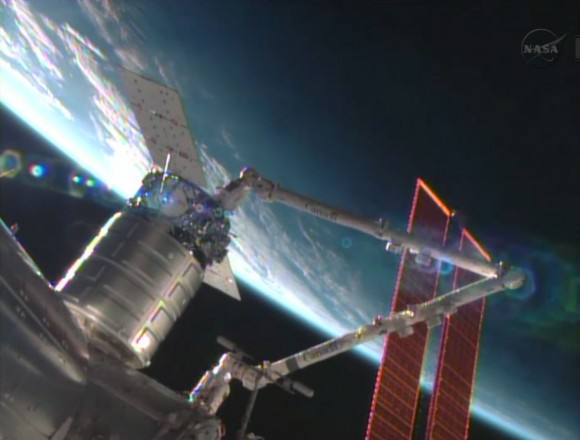 The Cygnus commercial resupply craft is installed by the Canadarm2 to the Harmony node. Credit: NASA TV
