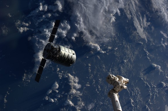 The Cygnus cargo spacecraft is just a few feet away from the International Space Station's Canadarm2 during rendezvous and berthing on Sept 29, 2013. Credit: NASA