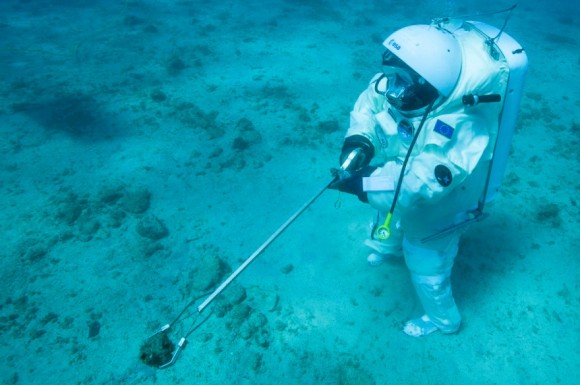 ESA astronaut Jean-François Clervoy collecting a rock sample underwater off the coast of Marseille, France. He was simulating the Apollo 11 mission underwater to prepare for future missions to the Moon, Mars or an asteroid. Credit: Alexis Rosenfeld