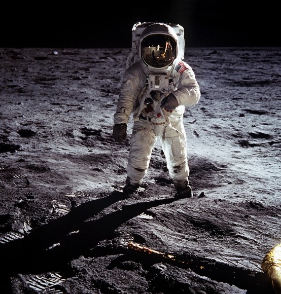 A teensy-tiny Neil Armstrong is visible in the helmet of Buzz Aldrin during the Apollo 11 landing in July 1969. Credit: NASA